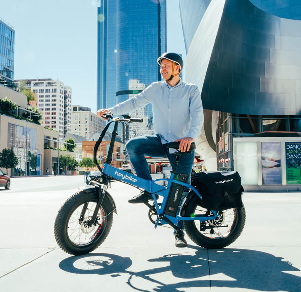 A man folds his Mars ebike and takes it on a plane.