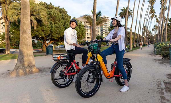 a man and girl are riding Horizon full-suspension ebike