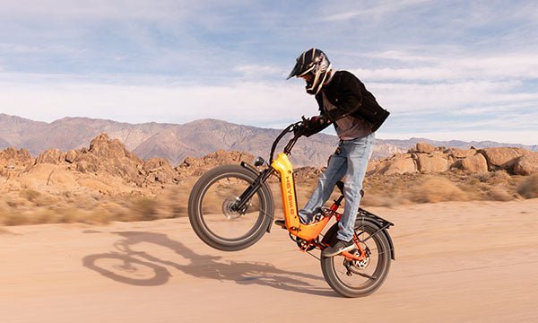 a man is riding Horizon full-suspension ebike