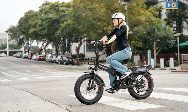 A girl is riding a Mars 2.0 e-bike with a 1000-watt motor