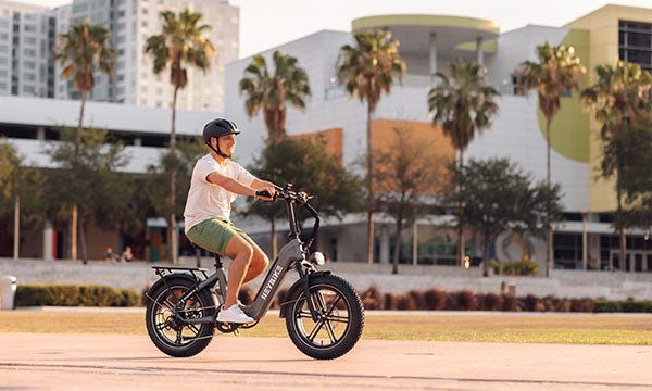 a man is riding Ranger S ebike with 20-inch wheel