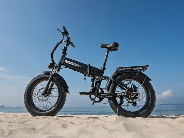 Heybike Mars 3.0 folding fat-tire electric bike on a sandy shoreline