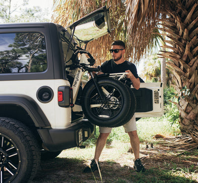 Heybike stock photo of folding the bike into a car